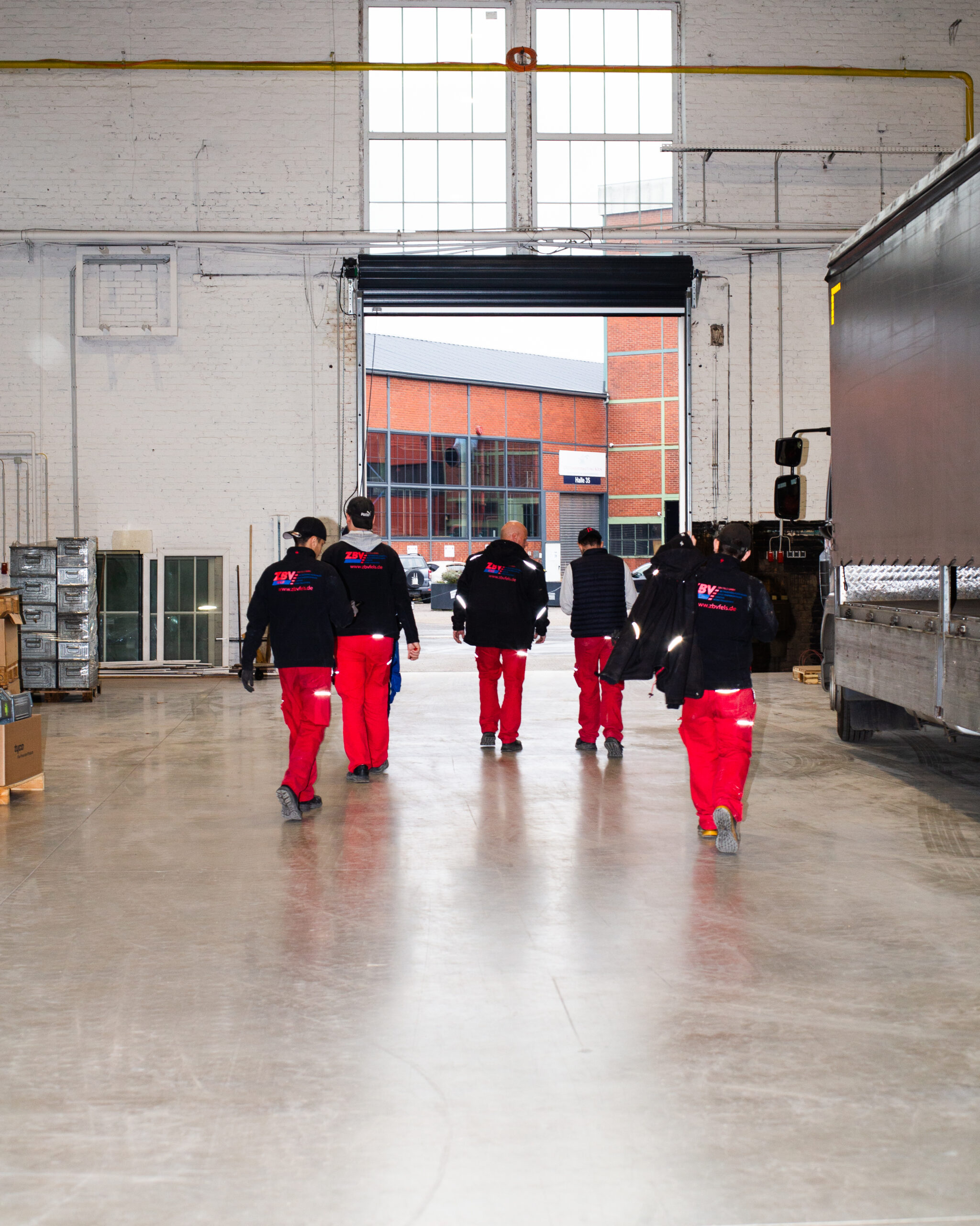 Photo of several employees running from behind